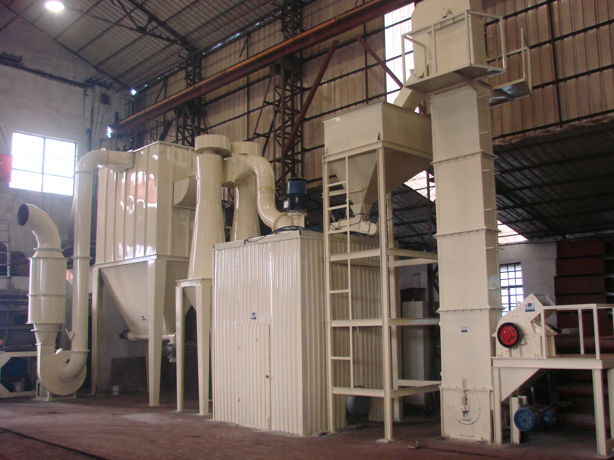 A ring-roller micro powder grinding system in the workshop.